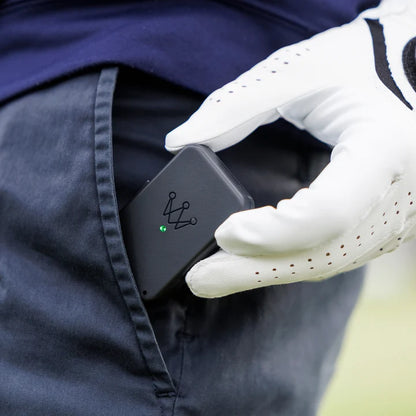 Person wearing a white glove inserting the Arccos Air into their pocket.