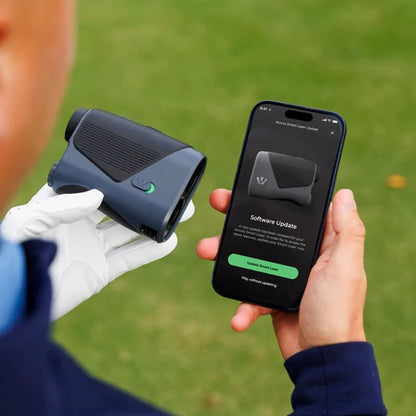 Person holding an Arccos Smart Laserand smartphone with Arccos app showing a software update for the laser