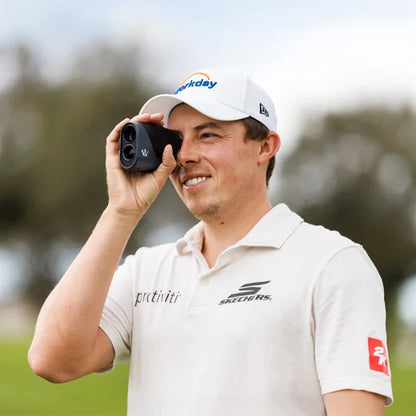 Matt Fitzpatrick using the Arccos Smart Laser on a golf course