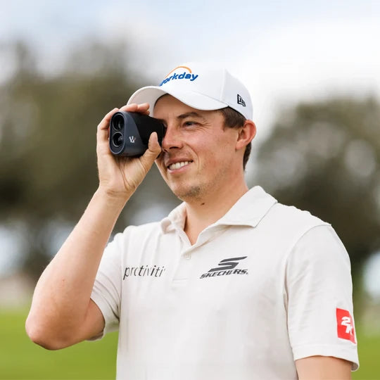 Matt Fitzpatrick using the Arccos Smart Laser on a golf course