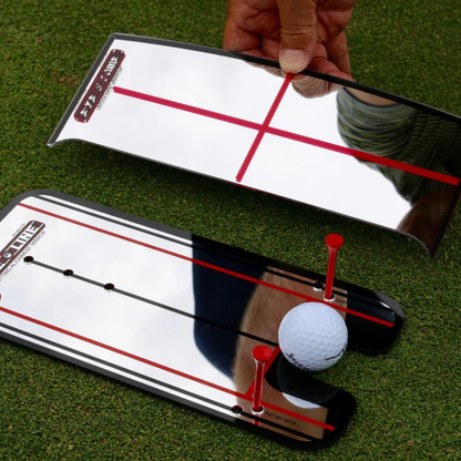 The Eyeline Golf Shoulder Putting Mirror with a ball on a green grass background