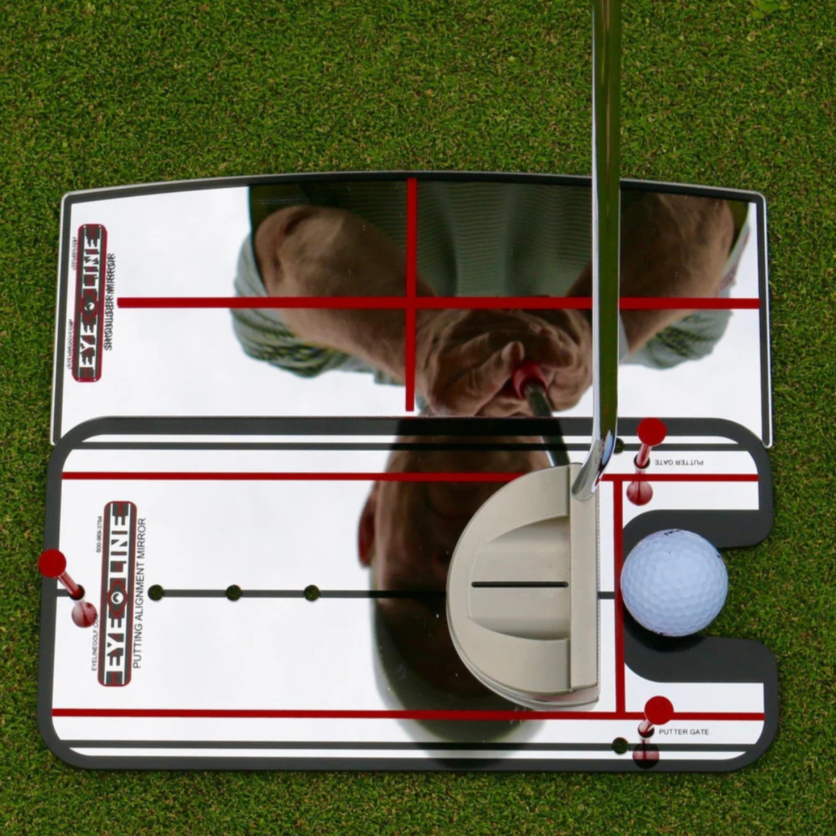 The Eyeline Golf Shoulder Putting Mirror with a person using it on a green background
