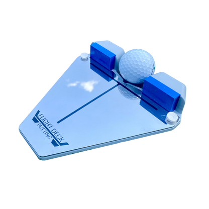 Putting training aid with a golf ball on a white background