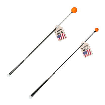 Two Orange Whip sticks with orange tips and 'Made in USA' tags on a white background