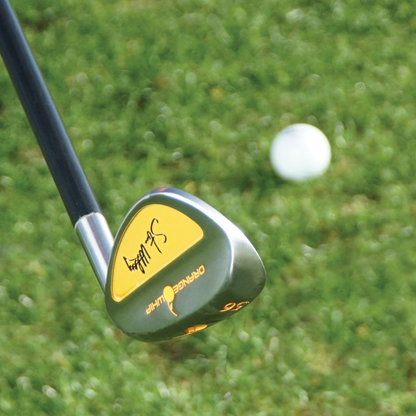 Orange Whip Wedge with a yellow accent color cover on a grassy background