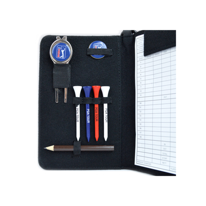 Golf accessories set including a pen, tees, and scorecard holder on a white background