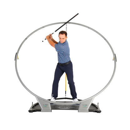 Man practicing golf swing on the PlaneSWING with a white background