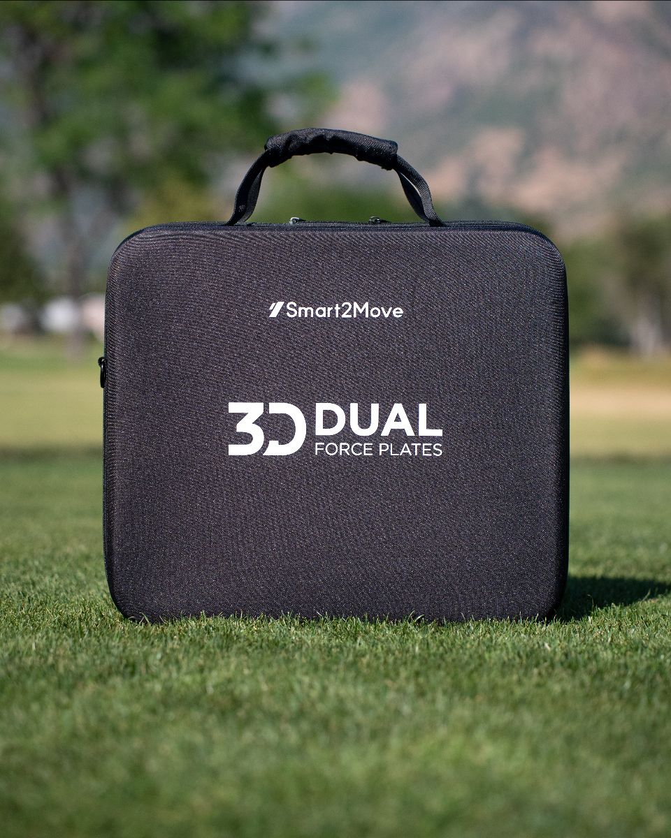 Black carrying case with 'Smart2Move' and '3D Dual Force Plates' logos on grass