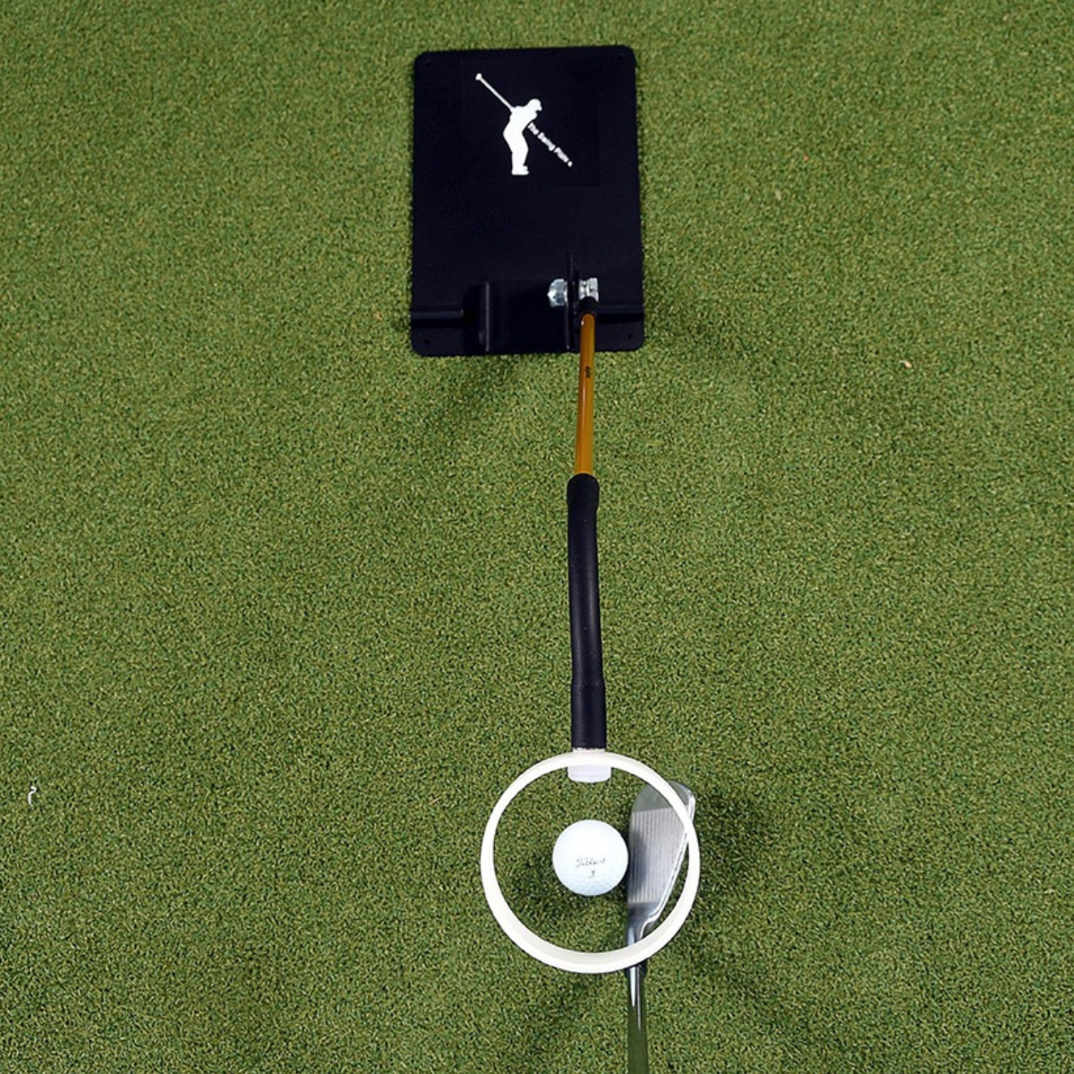 The Swing Eye with golf club and ball on a green surface